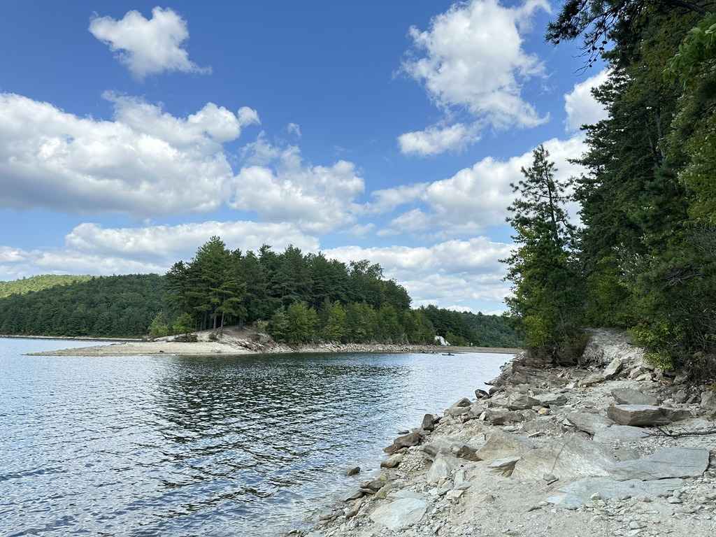 Rocky shoreline along the scenic Chambersburg Reservoir surrounded by forest in Franklin County.
