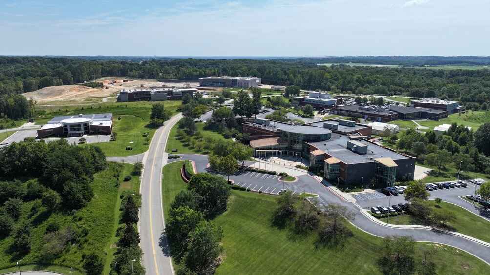 Aerial view of the Institute for Advanced Learning and Research in Pittsylvania County, showcasing modern buildings, green landscapes, and winding roads.