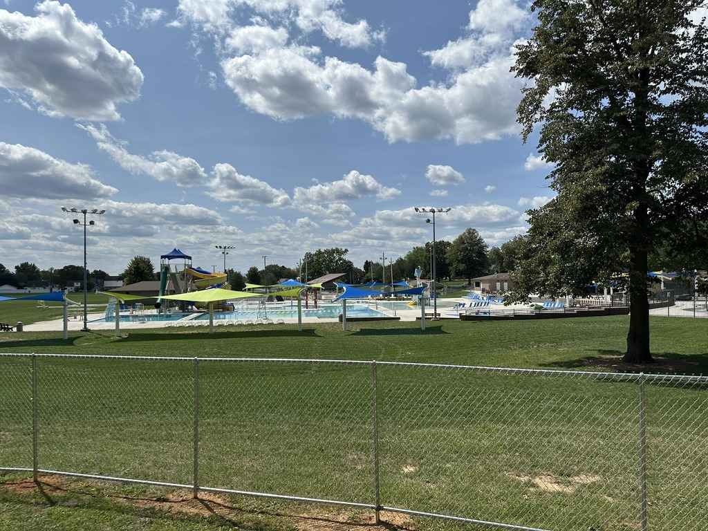 Chambersburg Aquatic Center in Franklin County with outdoor pools, shaded lounge areas, and a well-maintained lawn.